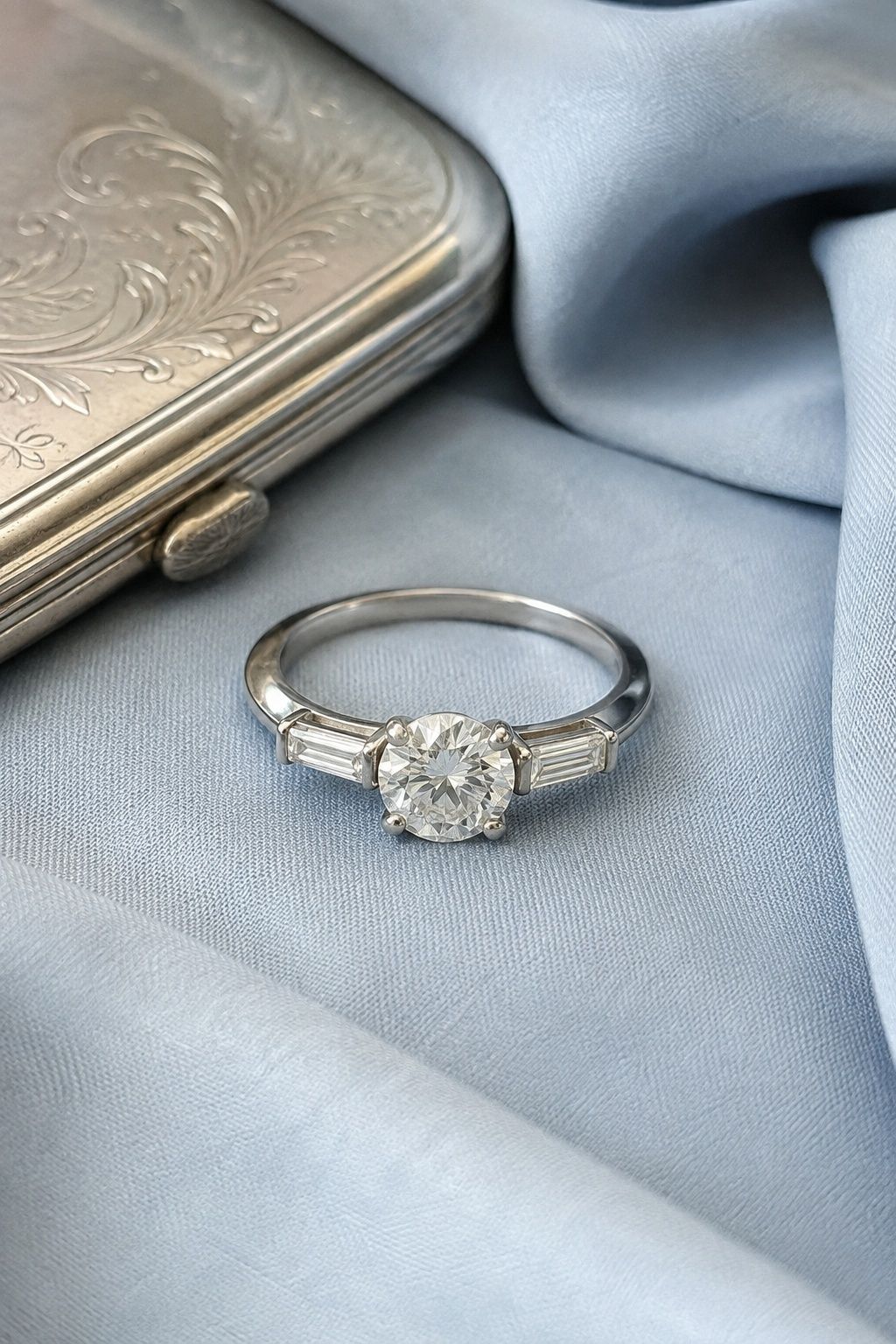White gold engagement ring with baguette side stones