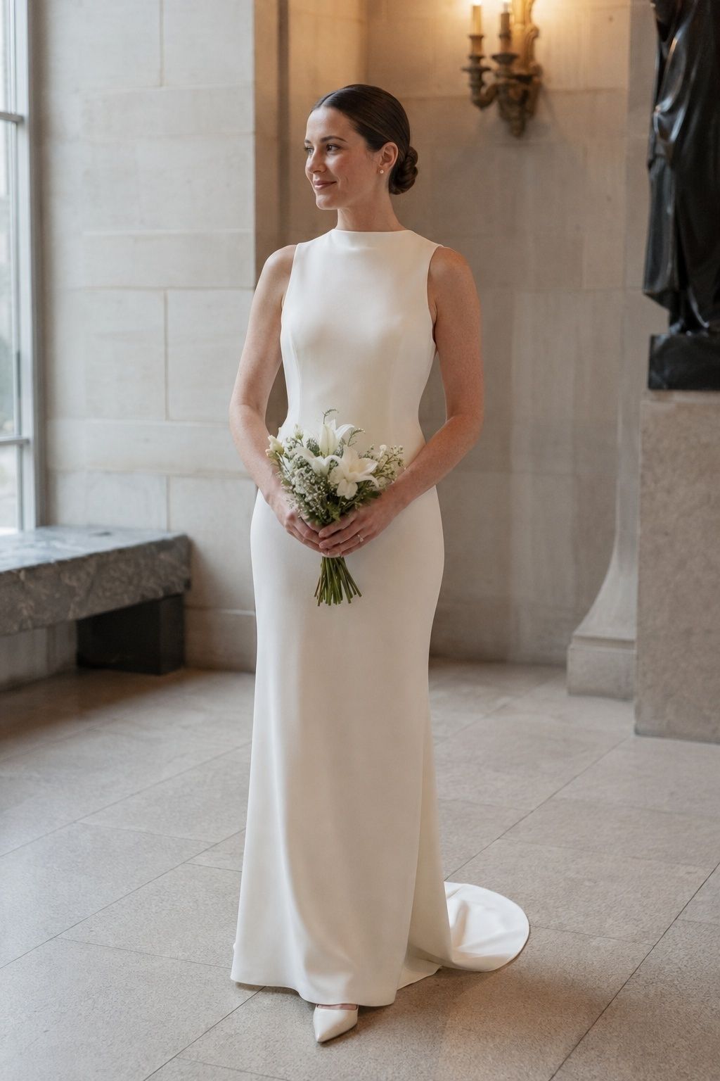 Bride in a high neck wedding dress with sleek low hair