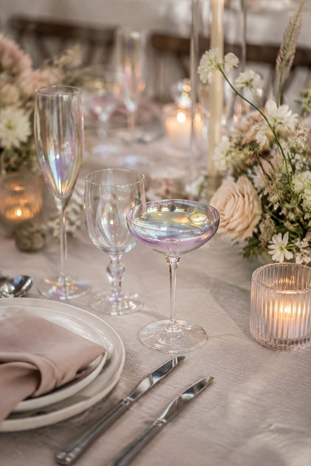 Iridescent glassware set on a neutral table