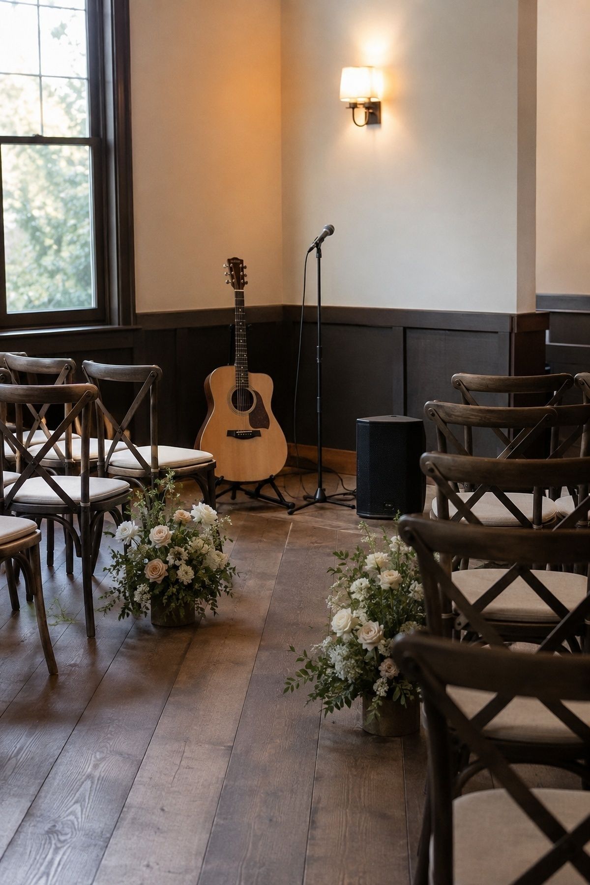 Simple acoustic guitar and compact speaker setup for a small restaurant wedding ceremony
