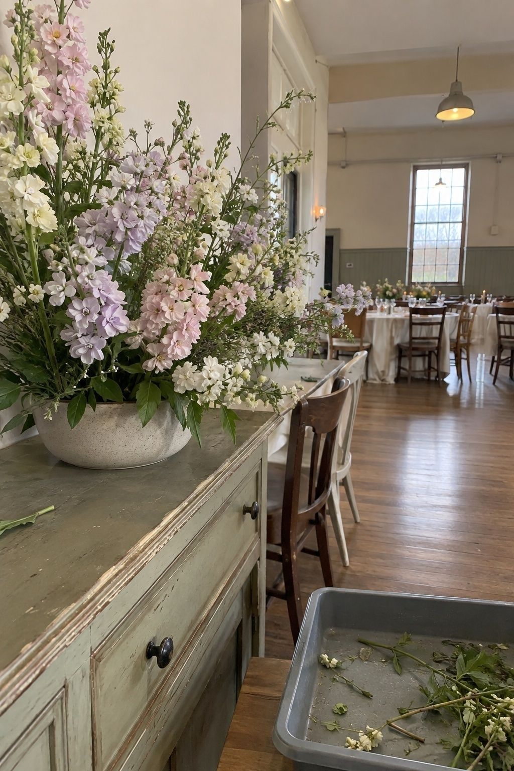 Stock flowers giving volume to a soft arrangement