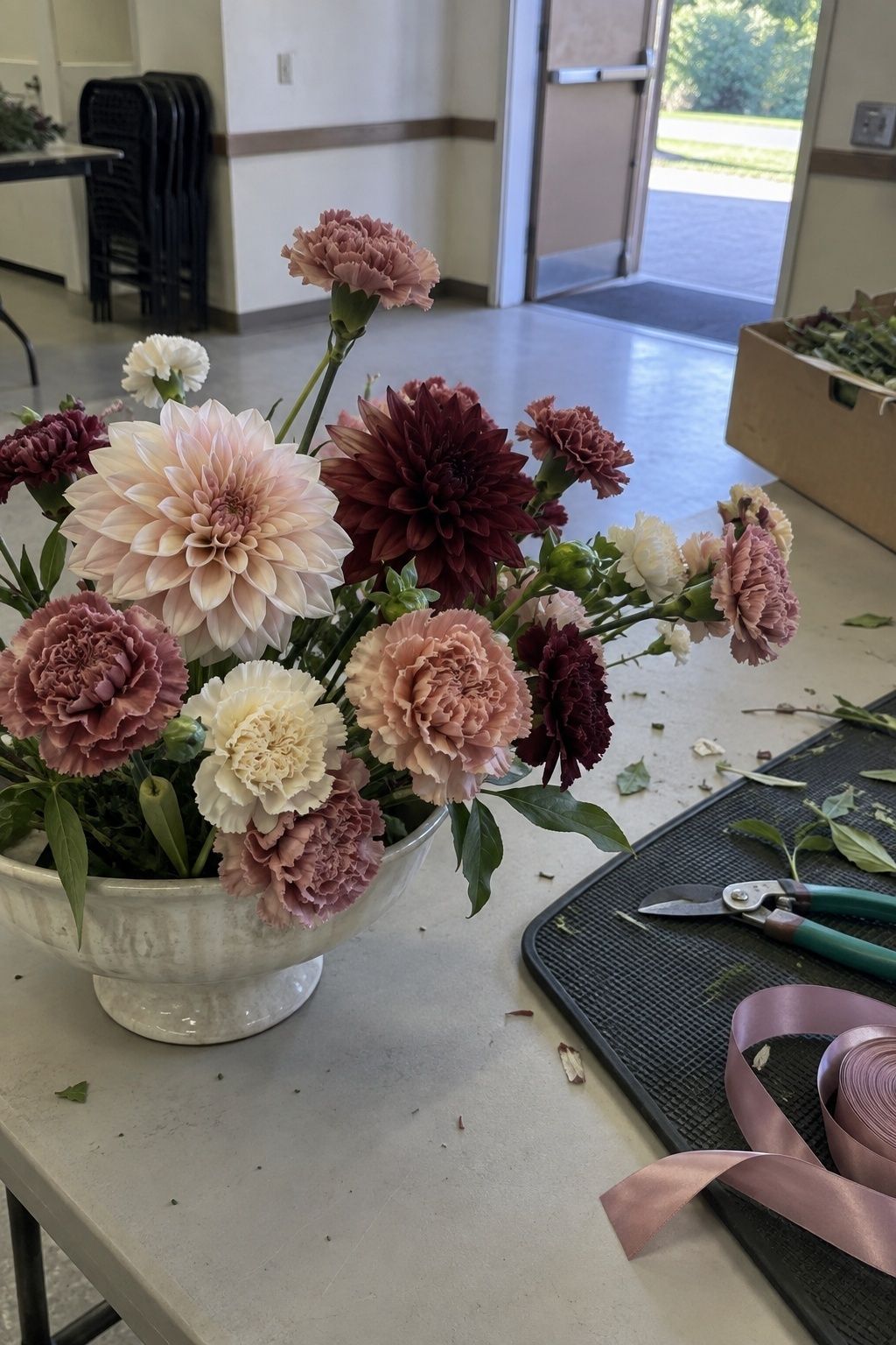 Carnations as a supporting flower in August arrangements