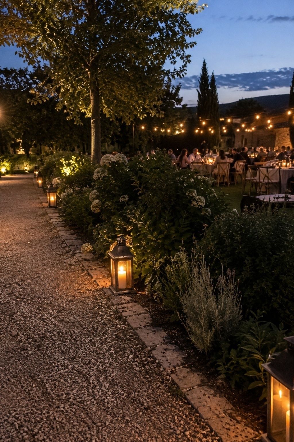 Lanterns glowing after sunset at an August reception