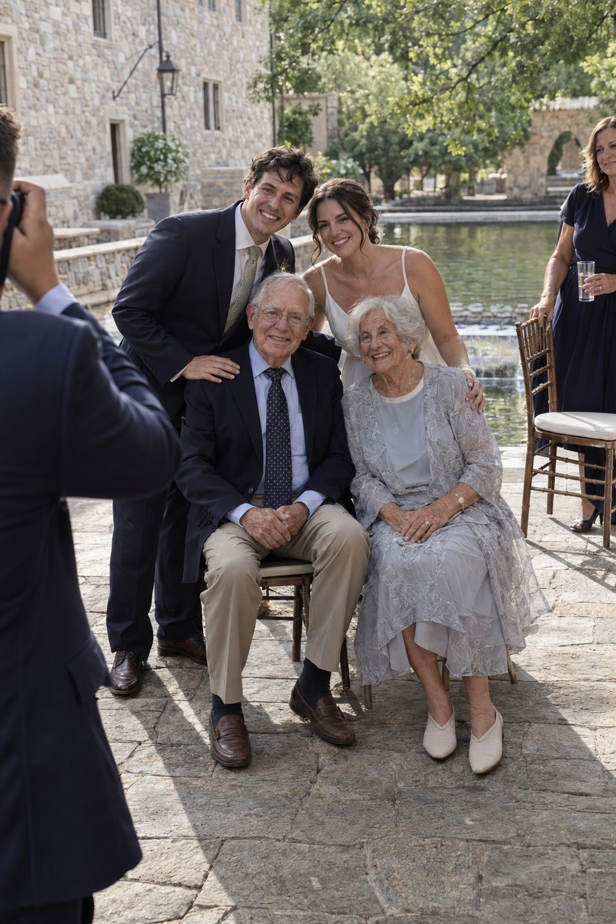 Newlyweds photograph two grandparents first in the August wedding family order.