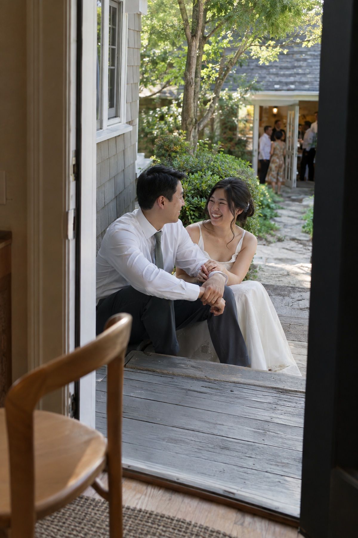 A newlywed couple shares a private five-minute pause outside their August reception.