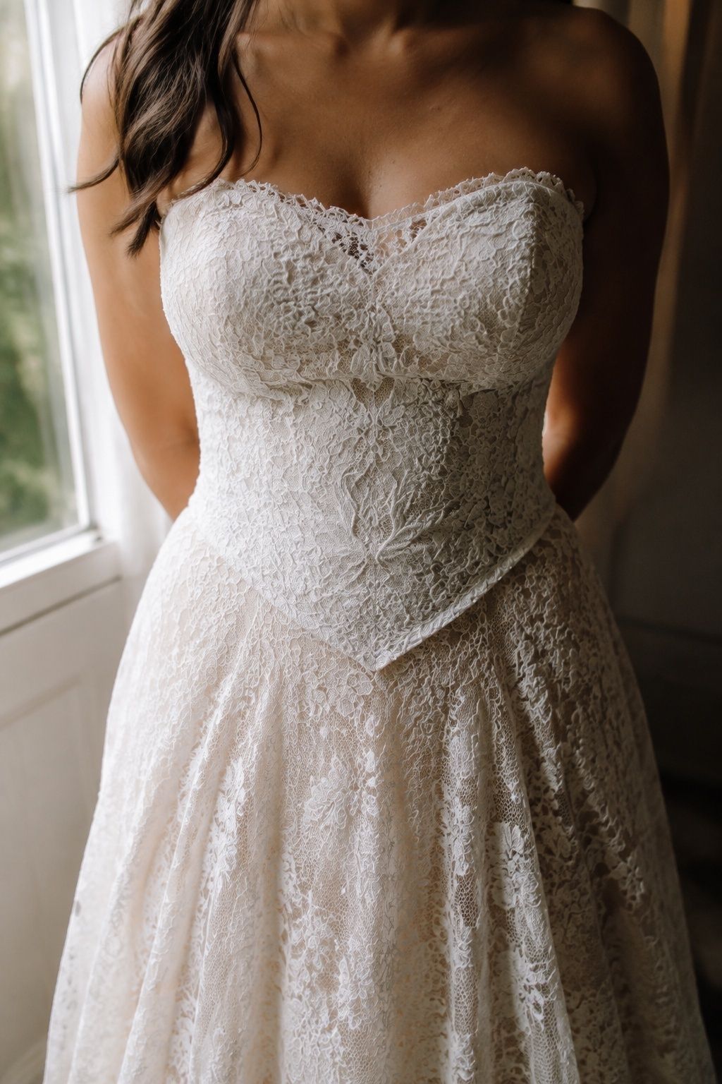 Floral lace bodice with a defined pointed basque waist