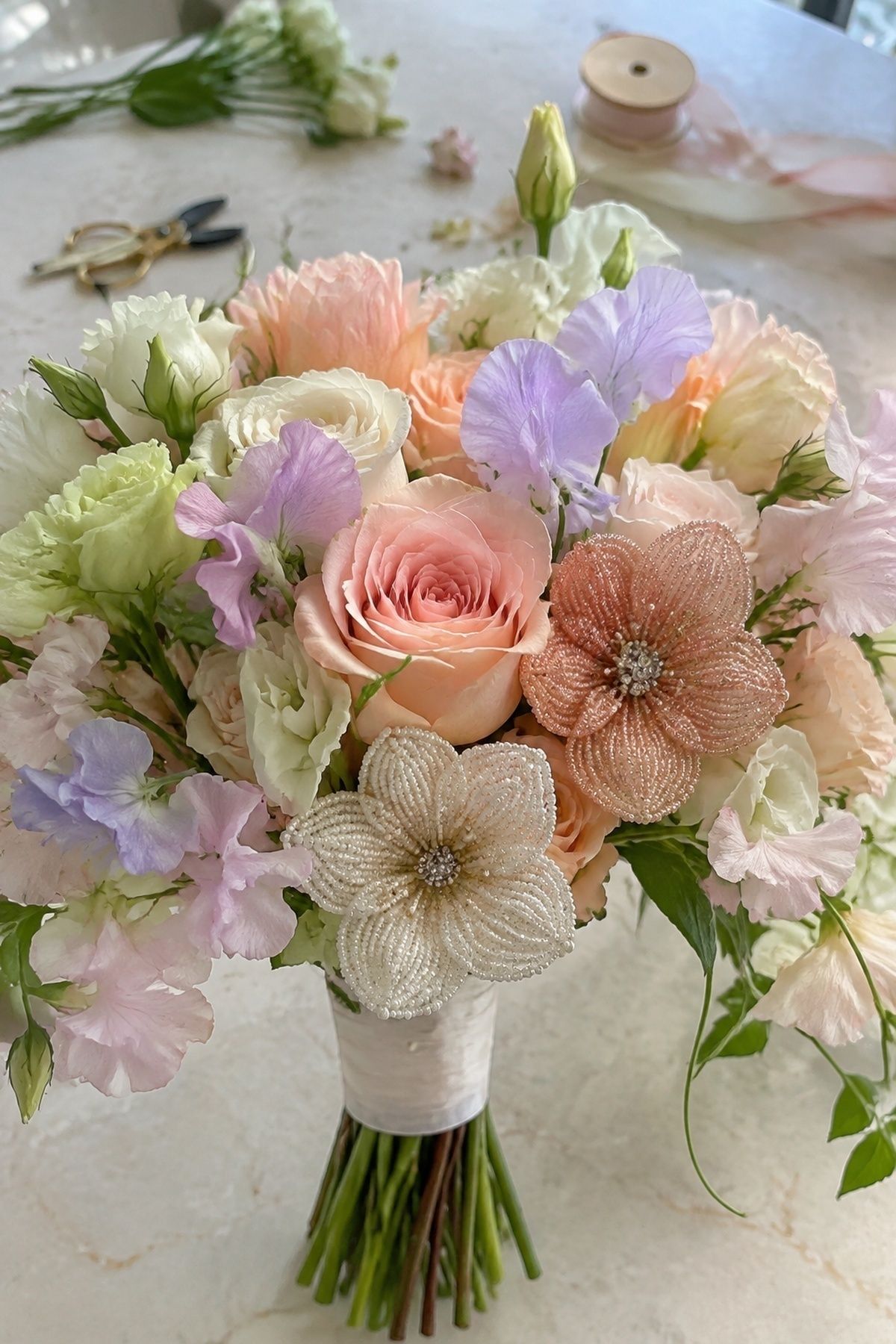 Beaded flowers mixed with fresh roses
