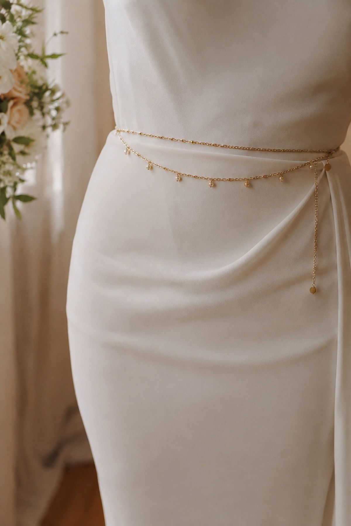 Gold waist chain with a simple wedding gown
