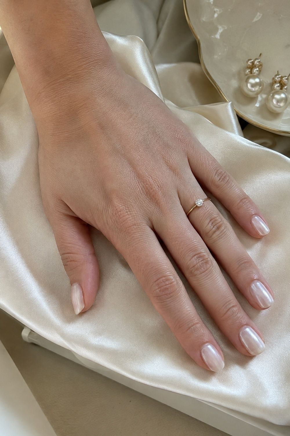 Milky white chrome nails with a clean bridal glow