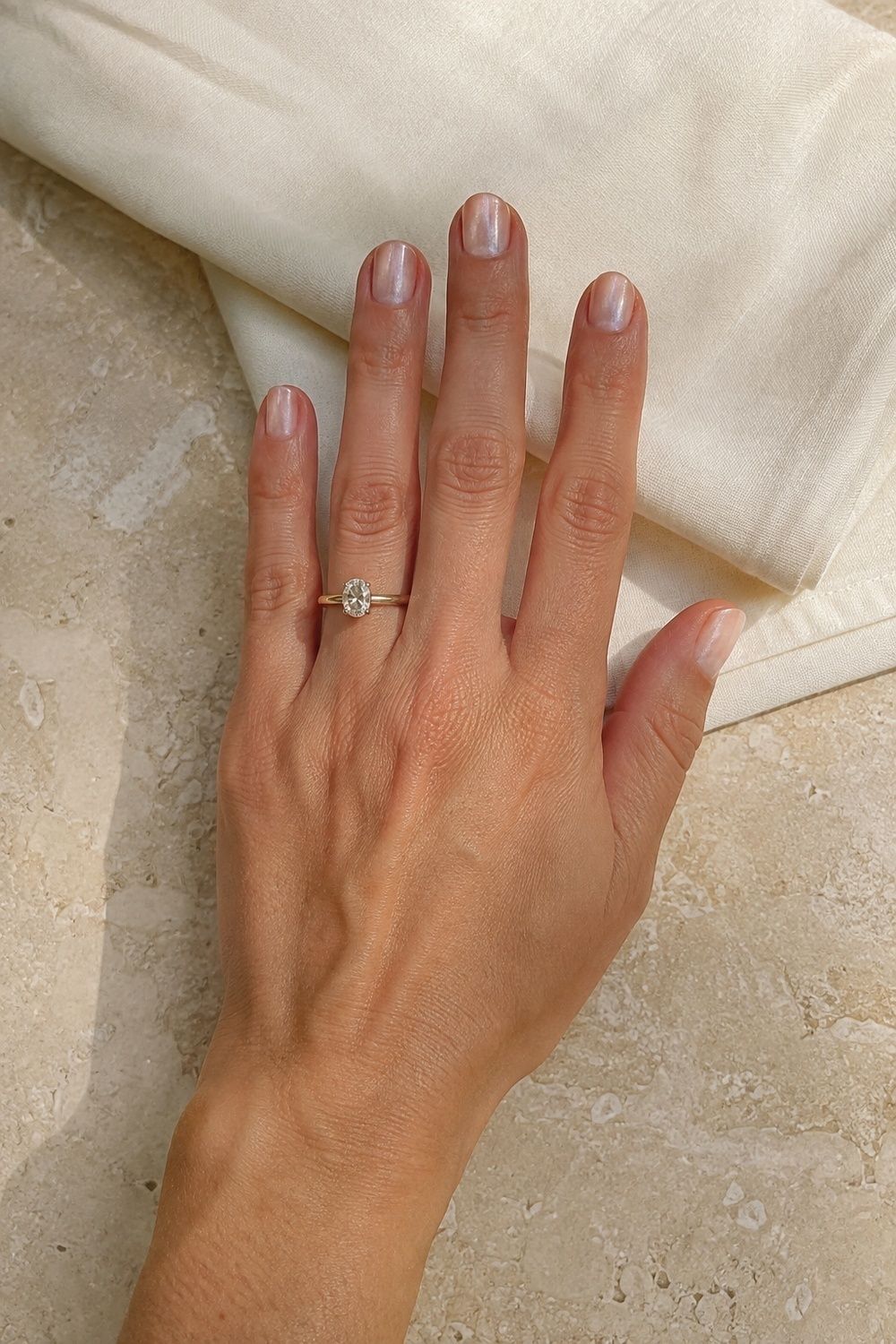 Nude chrome nails with a barely-there shimmer