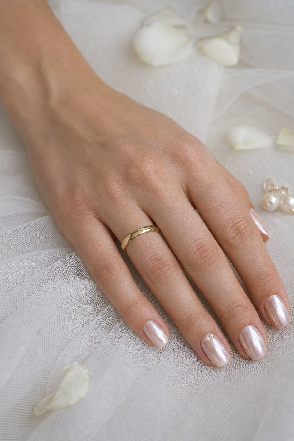 Pearl chrome nails with tiny cuticle pearls