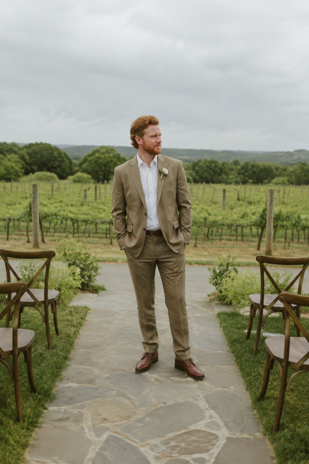 Light brown groom suit at an outdoor vineyard ceremony
