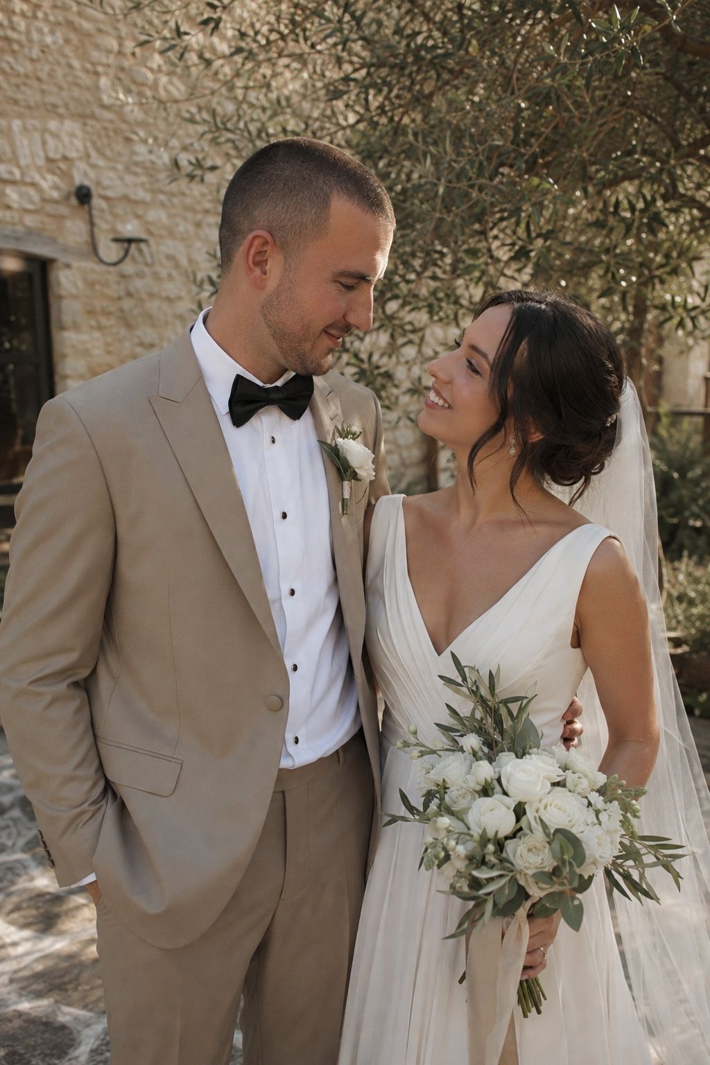 Groom in a champagne tuxedo at golden hour