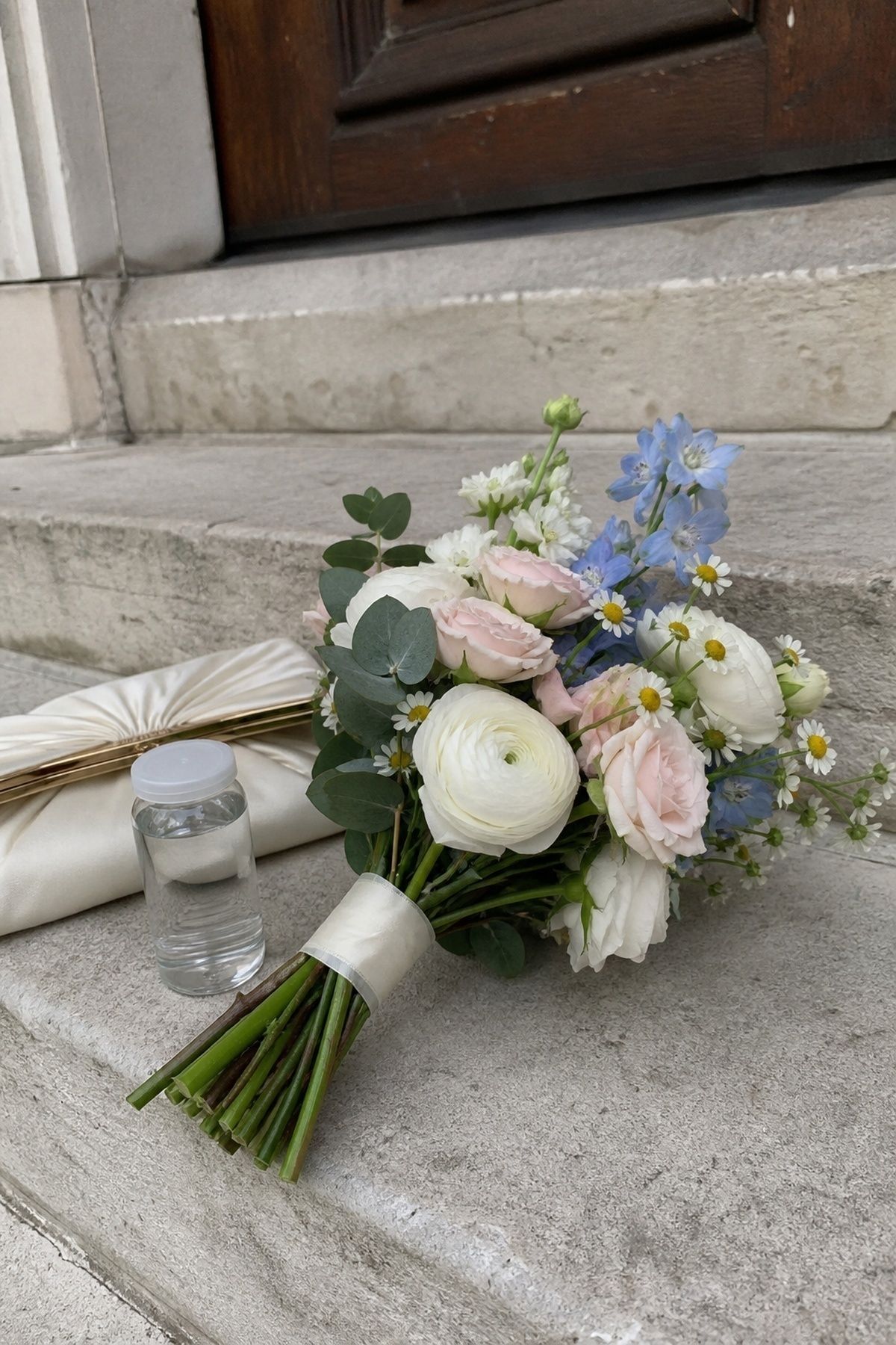 Small bouquet held on the courthouse steps
