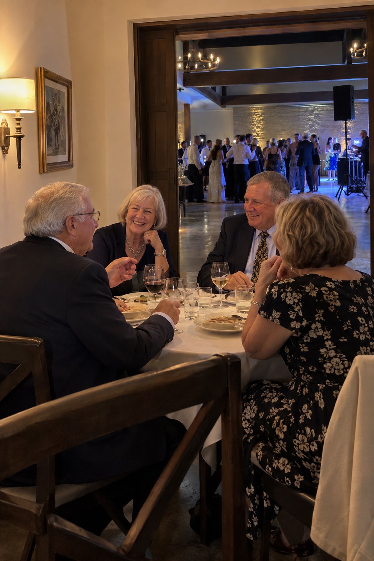 Older guests enjoy conversation at a table set well away from the dance-floor speakers.