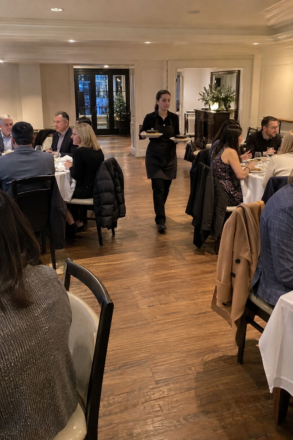 A wide aisle gives winter coats and dinner servers enough room between tables.