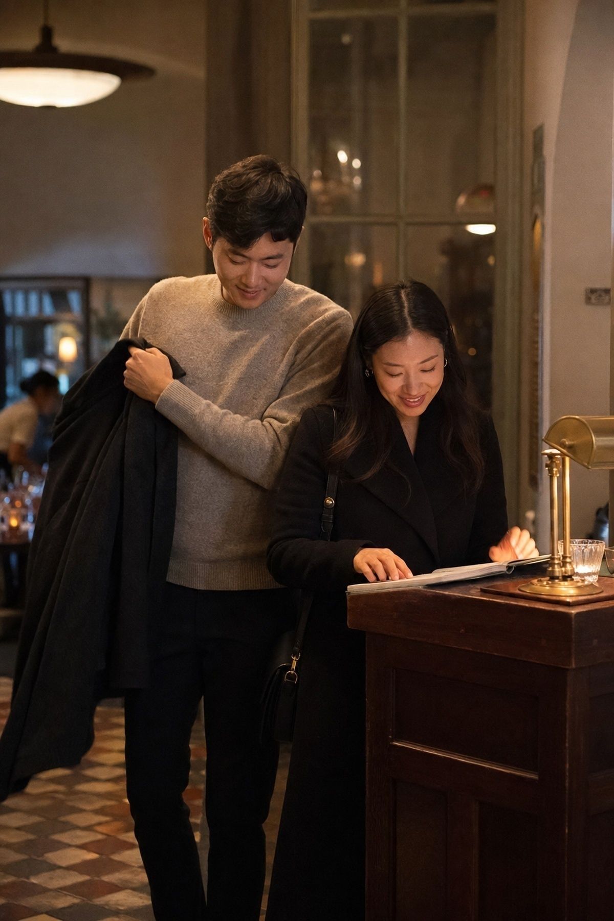 Dinner date engagement arrival photos at a warm restaurant host stand