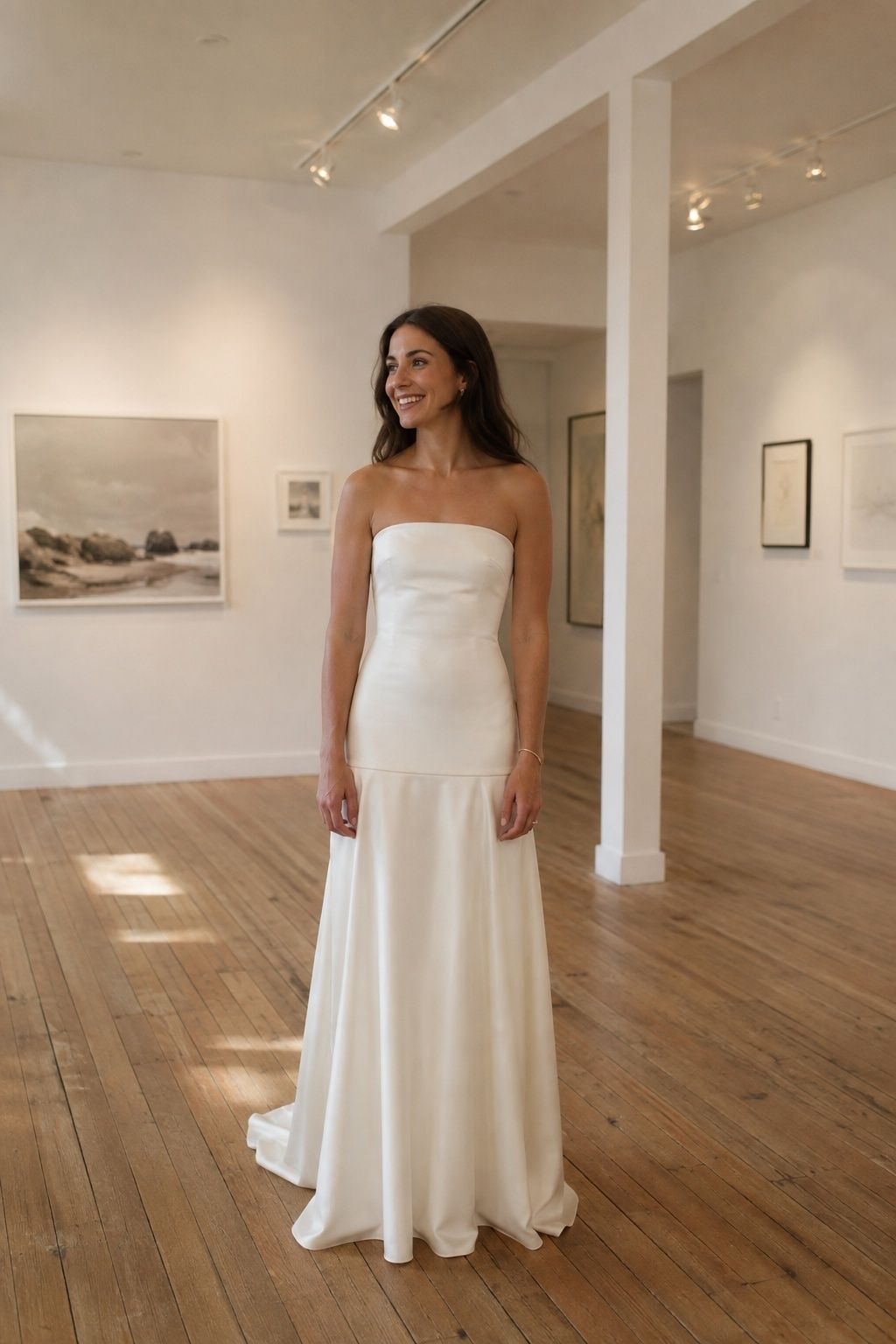 Bride in a straight drop waist satin gown at a small gallery