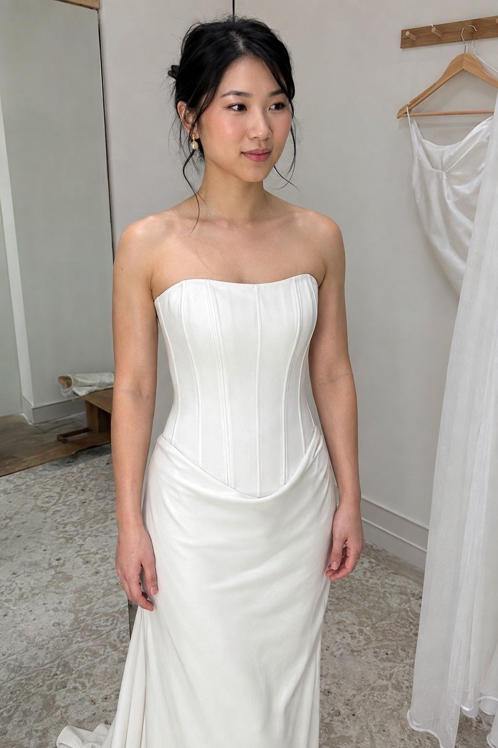 Corset drop waist dress with visible boning and a low curved seam