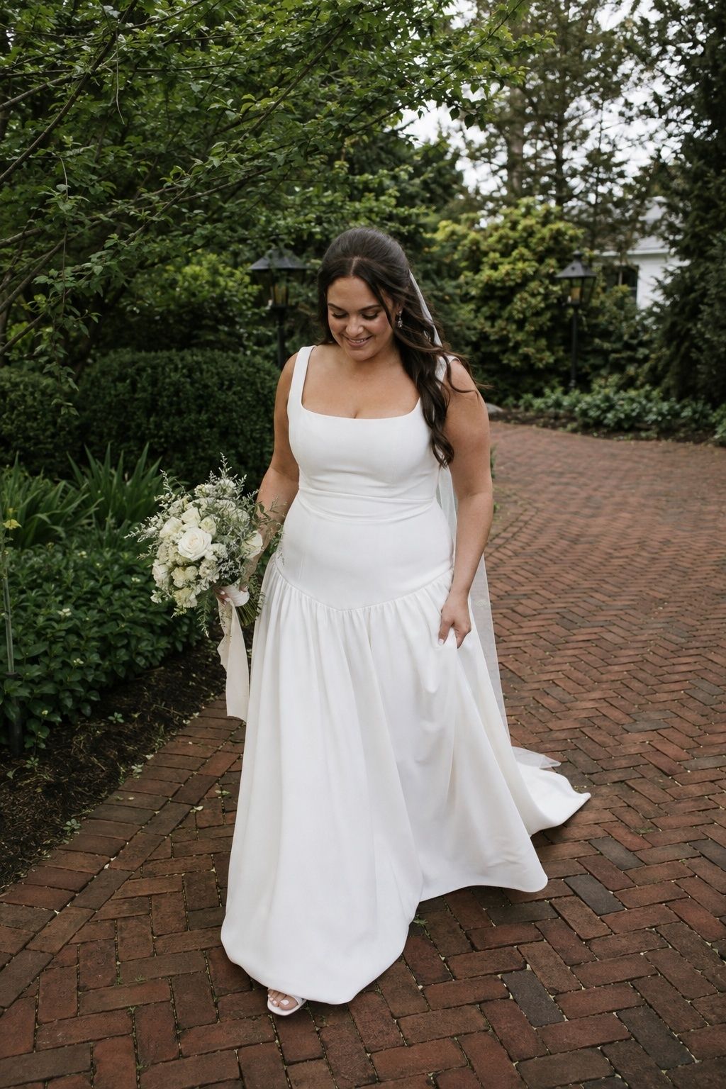 Bride walking in a square neck drop waist A-line gown