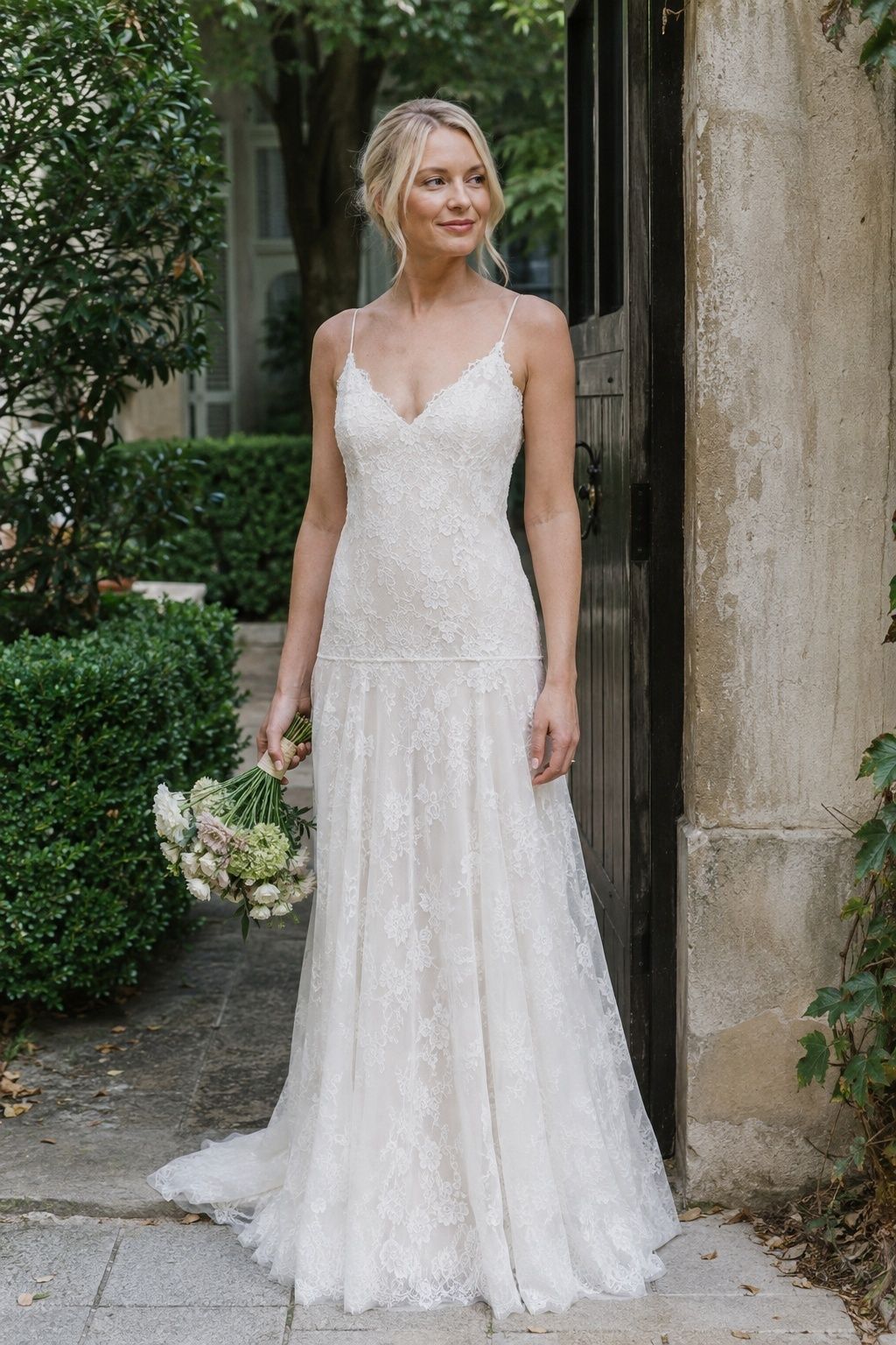 Fine lace wedding gown with a lowered waist and softly gathered skirt