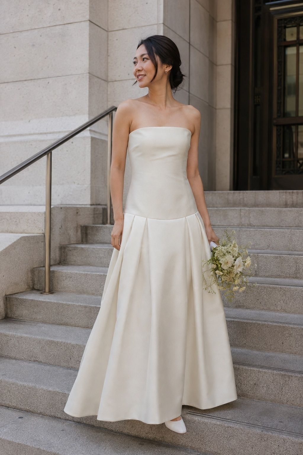 Mikado drop waist gown with crisp pleats at registry office steps