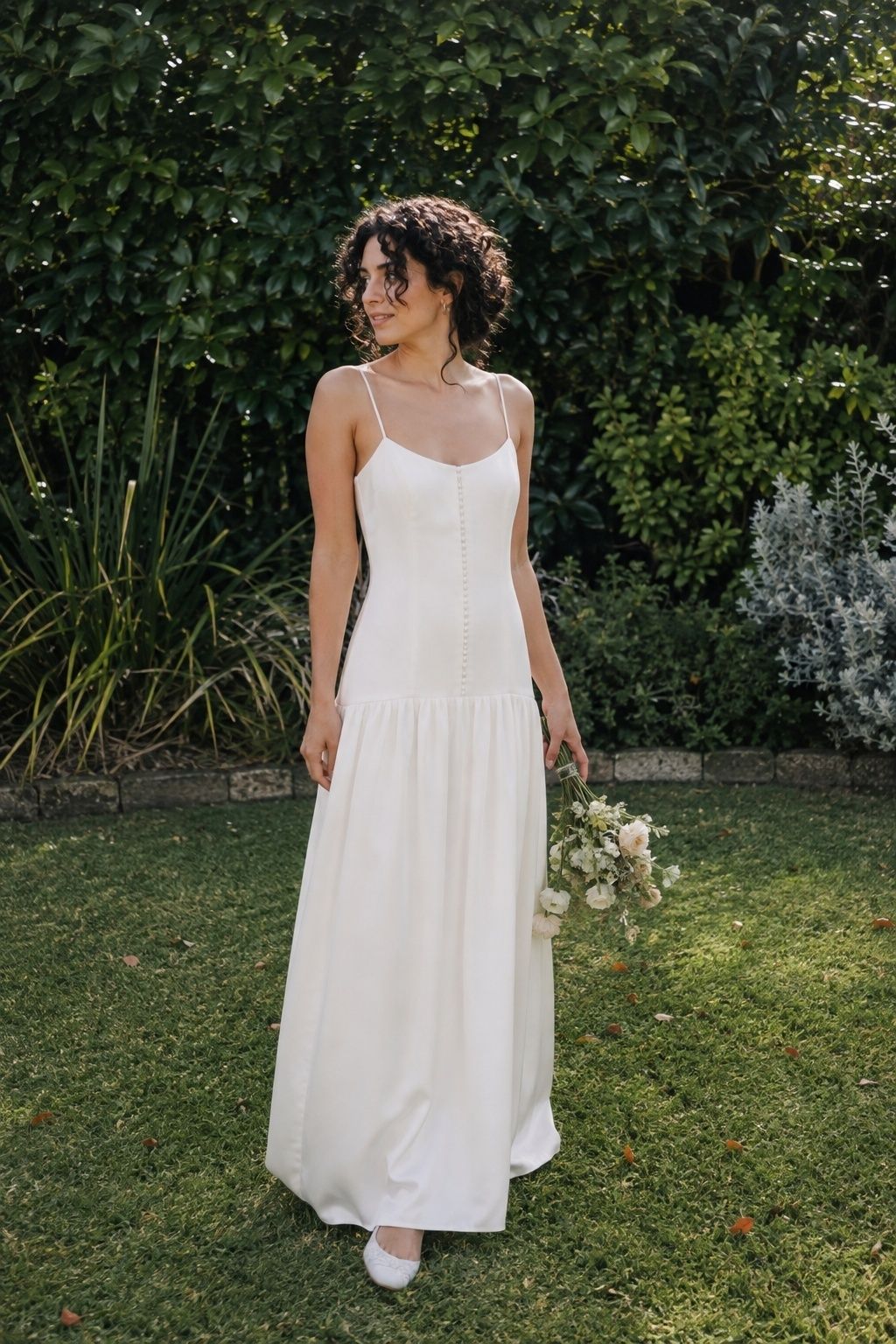 Dainty drop waist dress with thin straps and small covered buttons