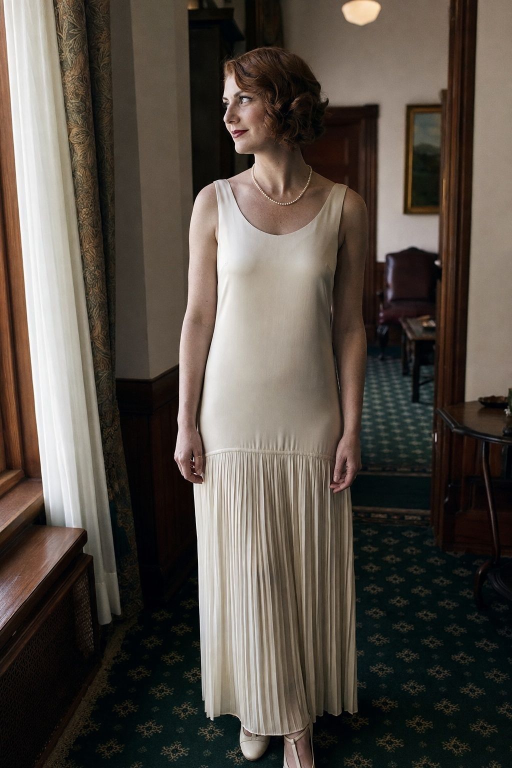 Vintage-inspired drop waist wedding gown with a pearl strand