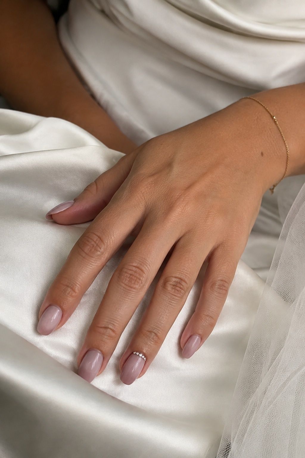 Dusty rose nails with clear crystals