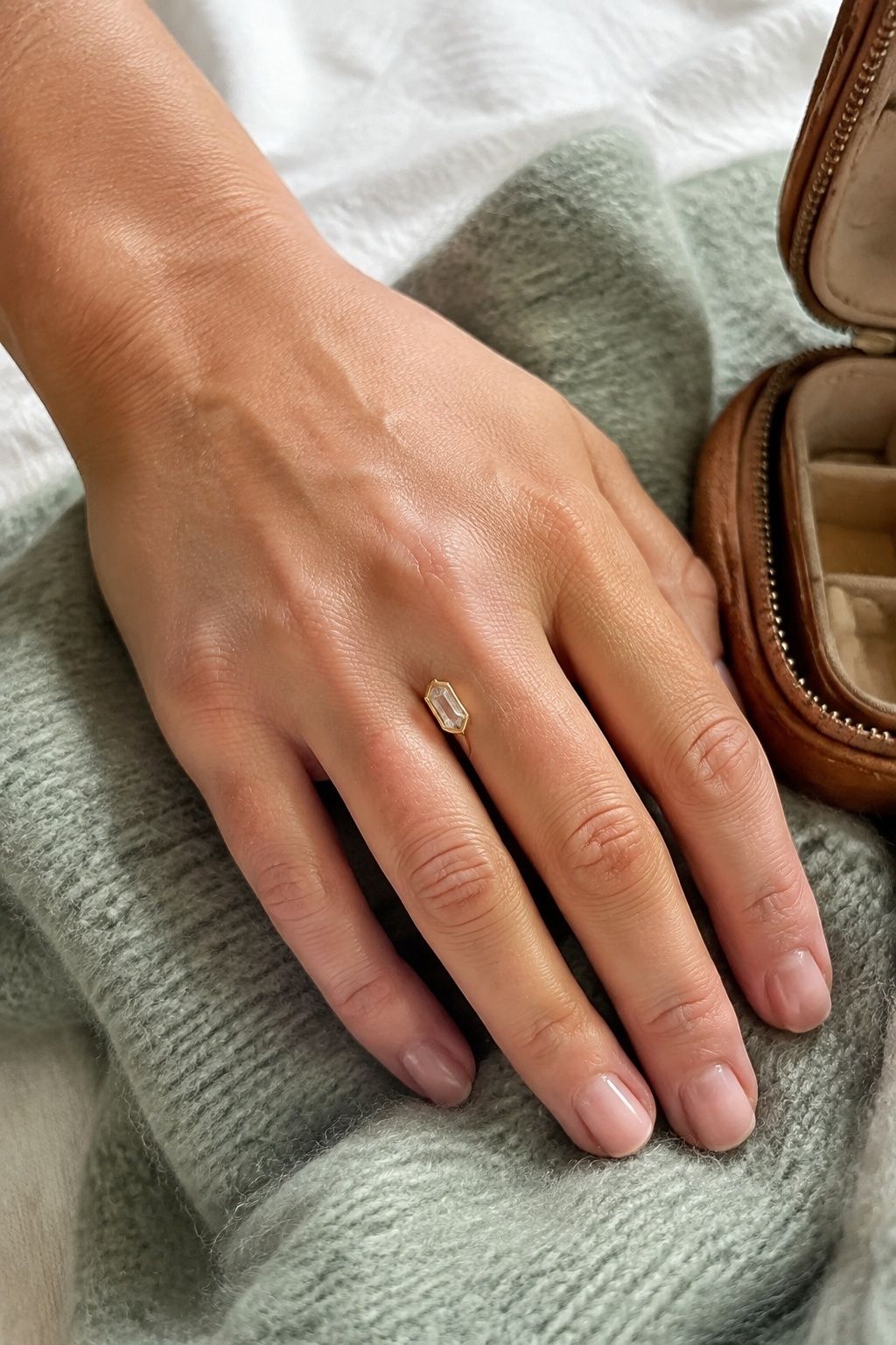 Elongated hexagon in a fine bezel setting