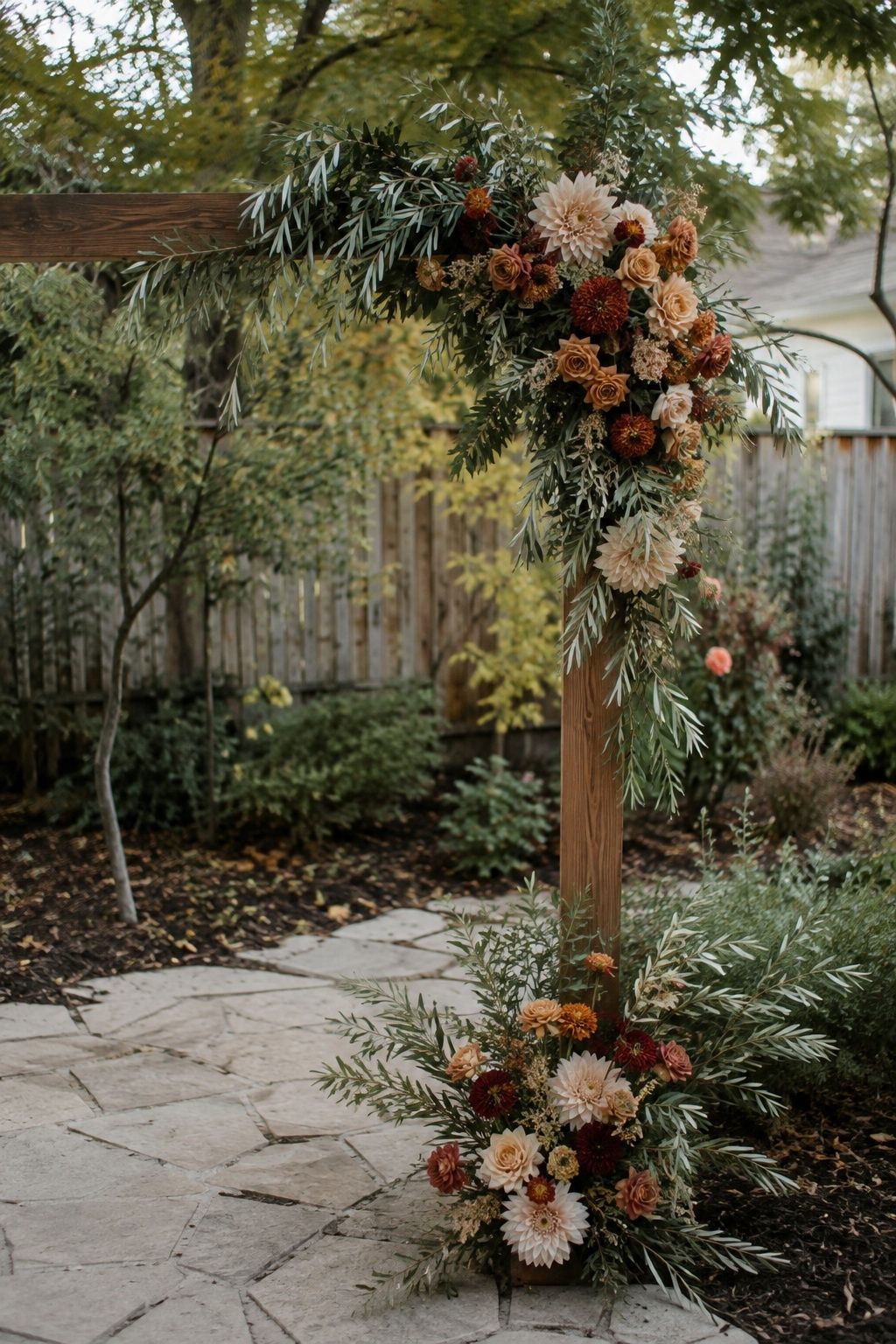 Faux greenery arch mixed with fresh flowers