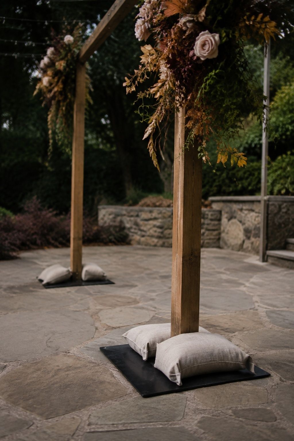 Outdoor ceremony arch anchored against wind