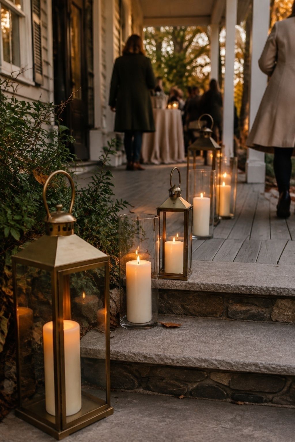 Outdoor candles protected in lanterns and hurricane glass