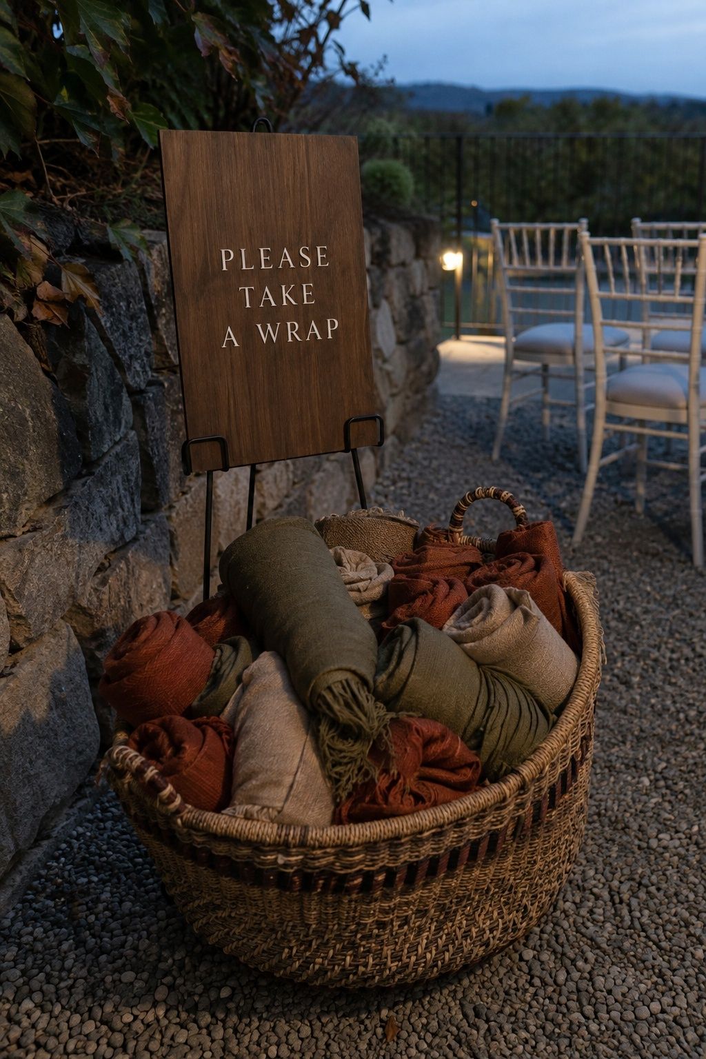 Olive, rust and oat pashmina wraps in a shared vineyard basket