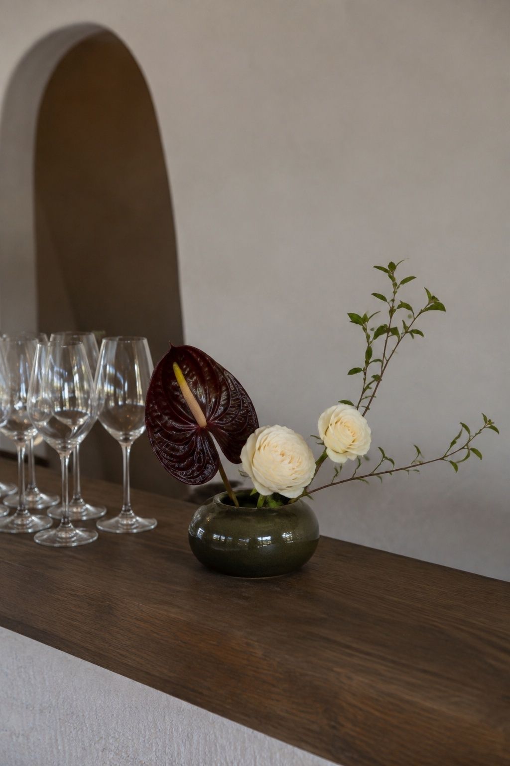 Chocolate anthurium accent in a small wedding bar arrangement
