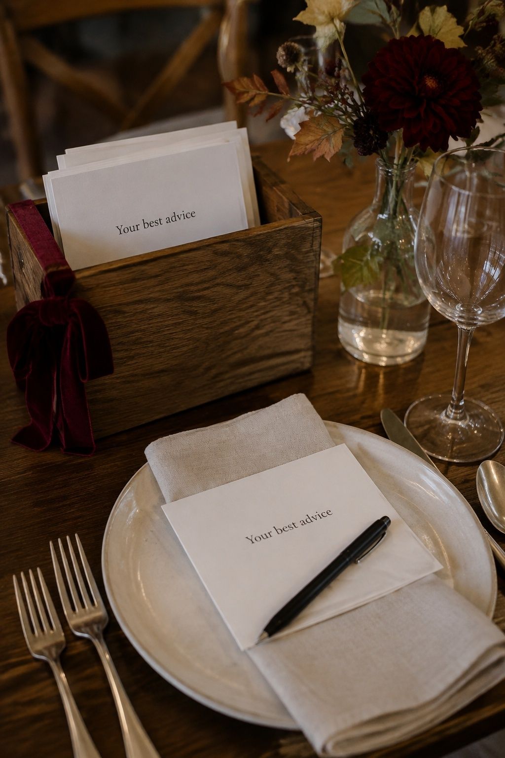 Wooden advice card box beside an autumn dinner place setting