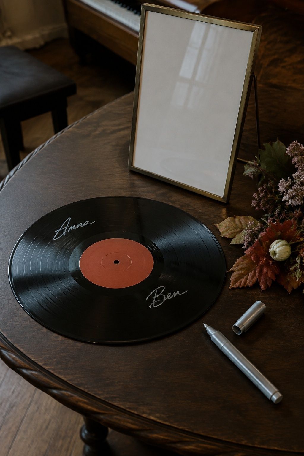 Vinyl record with silver guest signatures and a paint pen