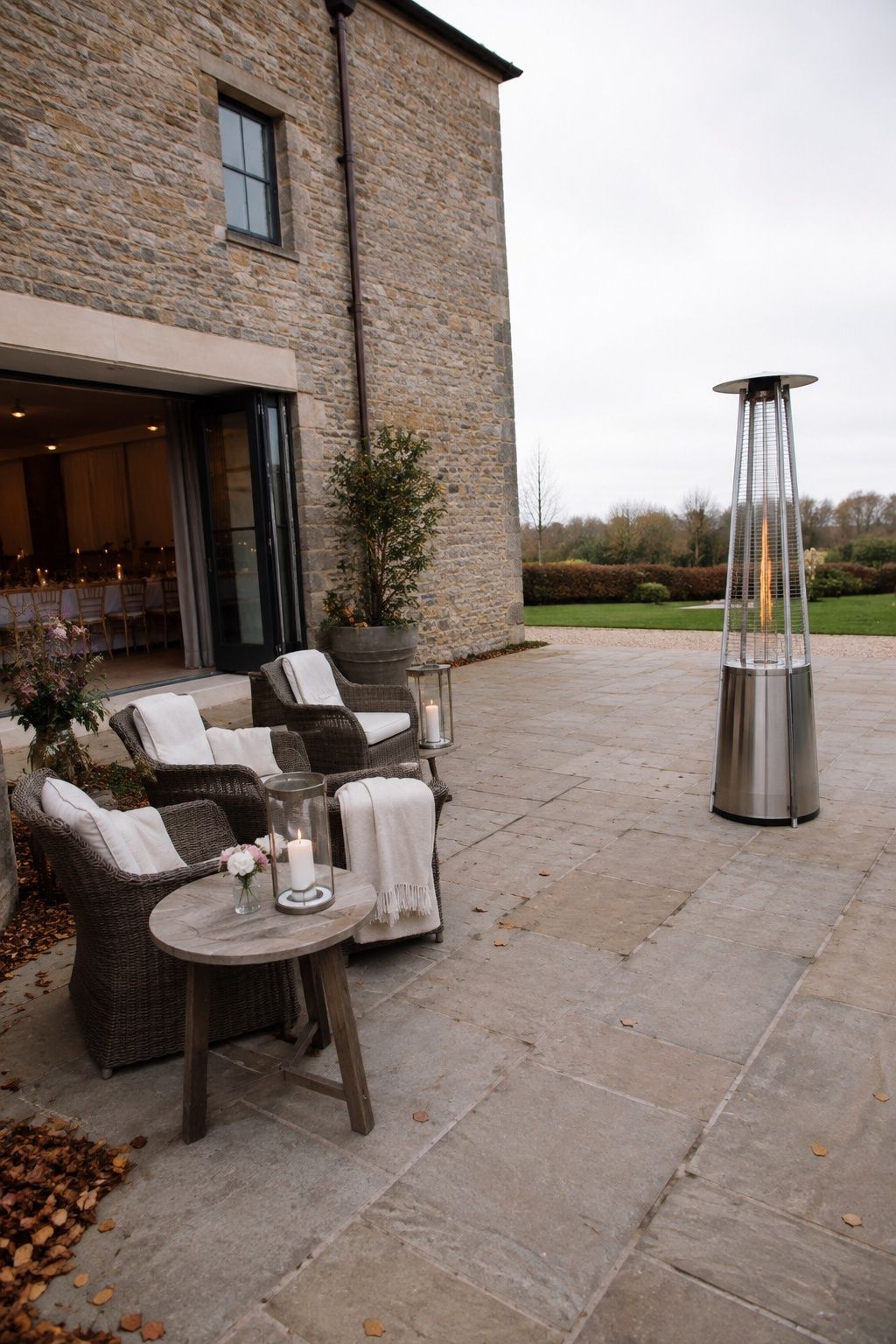 Autumn reception courtyard lounge with wool throws and a safely spaced patio heater