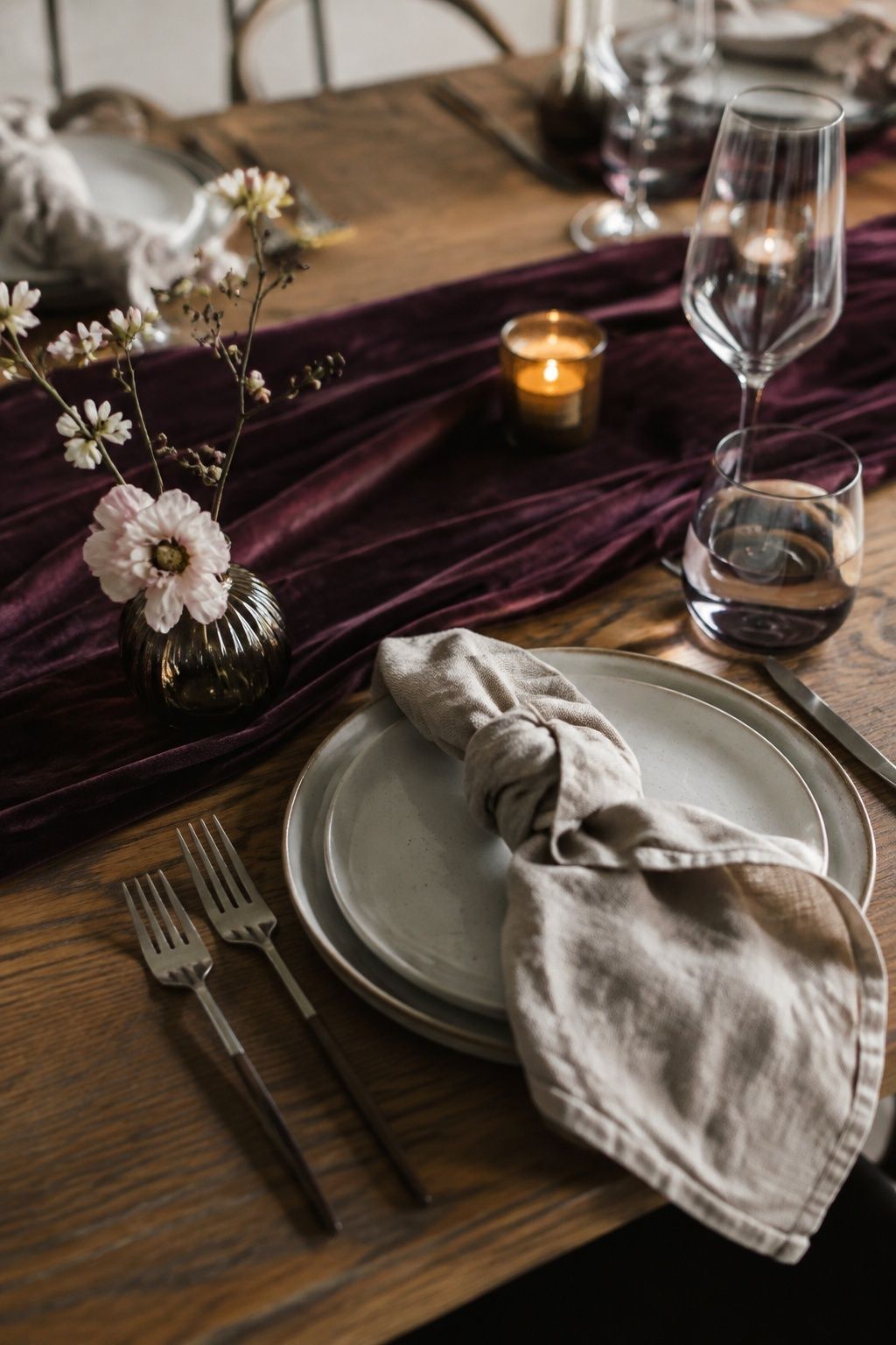 Plum velvet runner and flax linen napkin with simple cream dinnerware