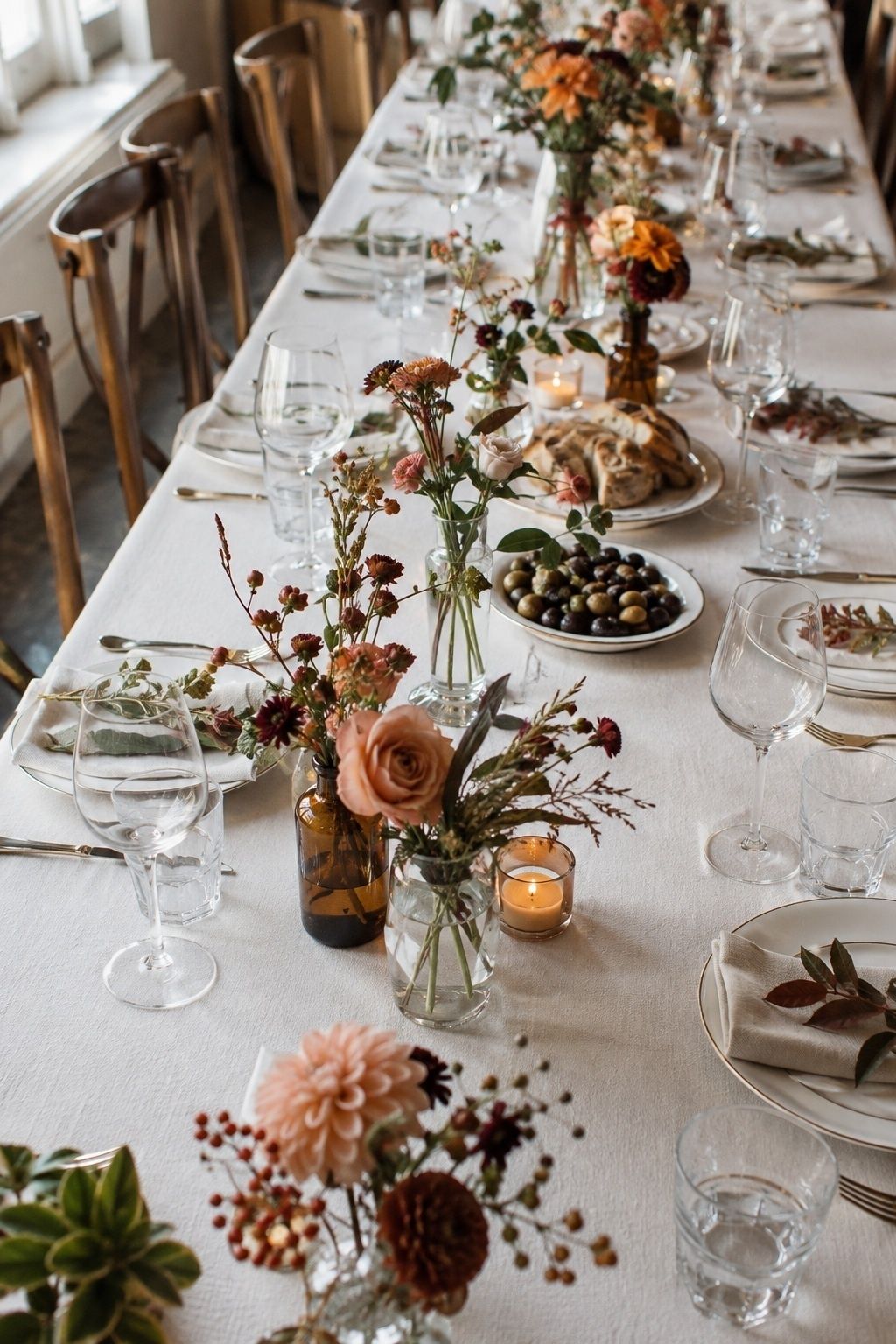 Bud vases along a narrow table