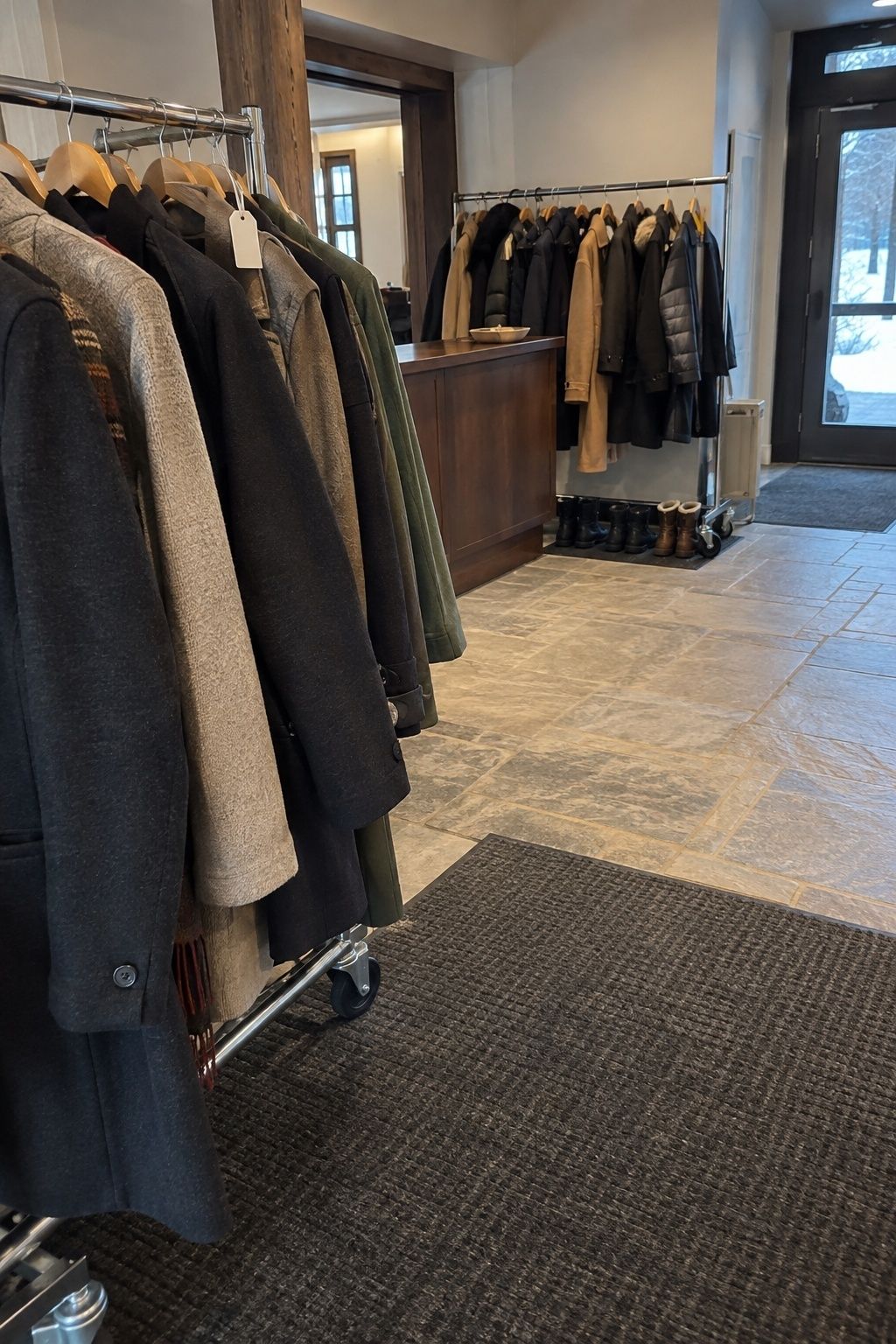 Set-back February wedding coat check with a clear entry lane