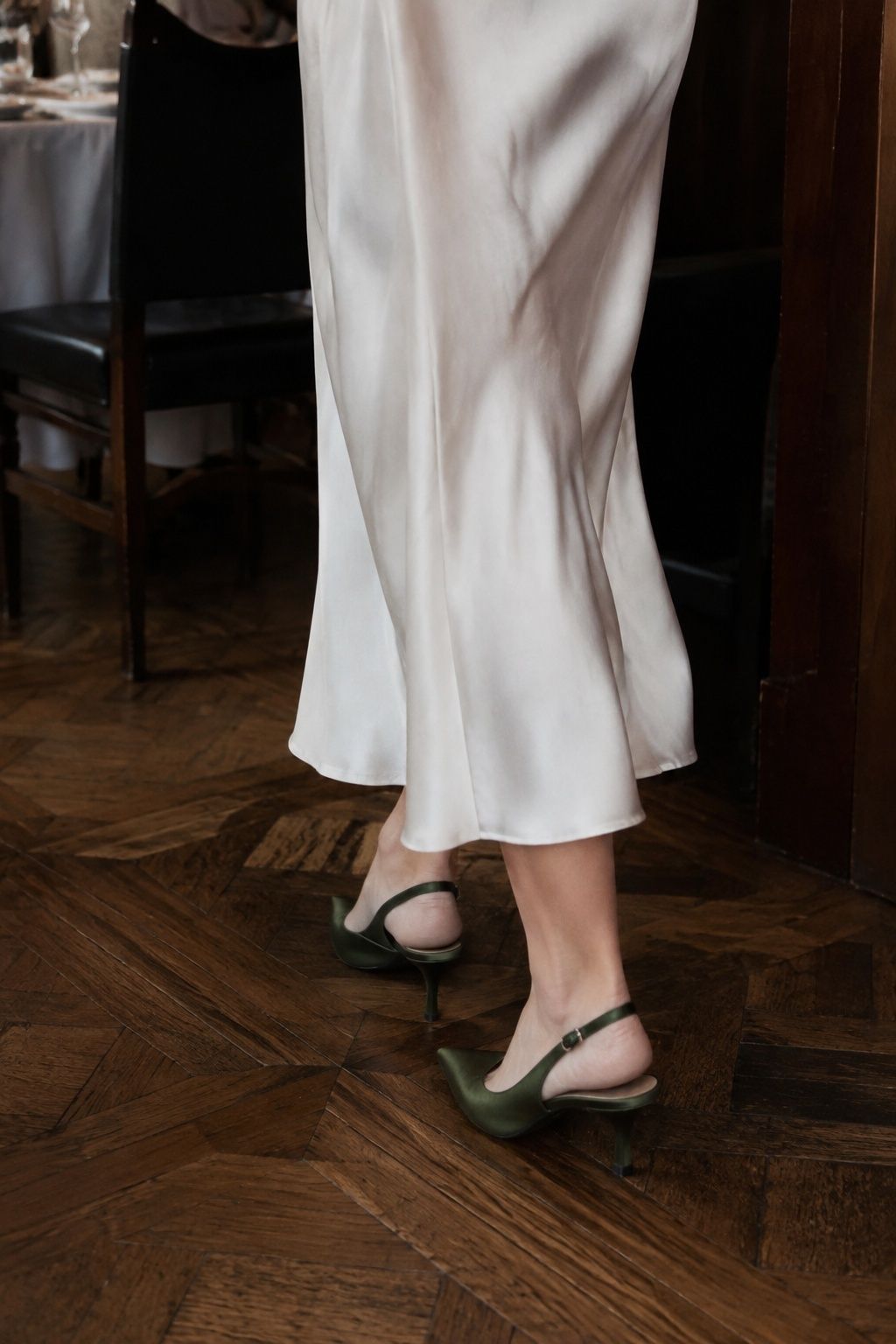 Green slingbacks worn with a slip dress