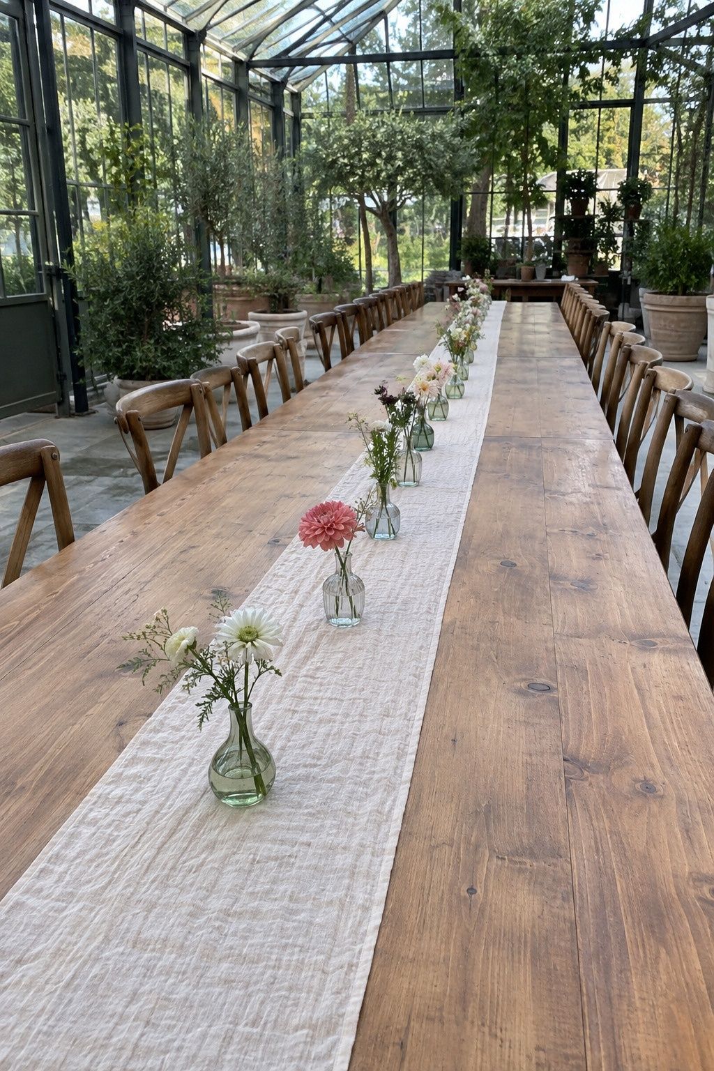 Greenhouse wedding idea: add bud vases instead of large installations