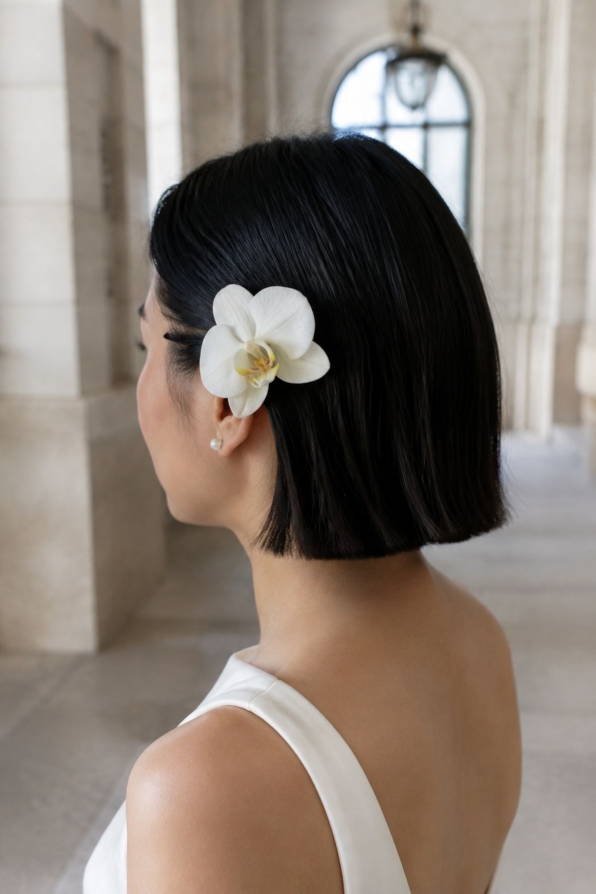 Single statement bloom tucked behind the ear