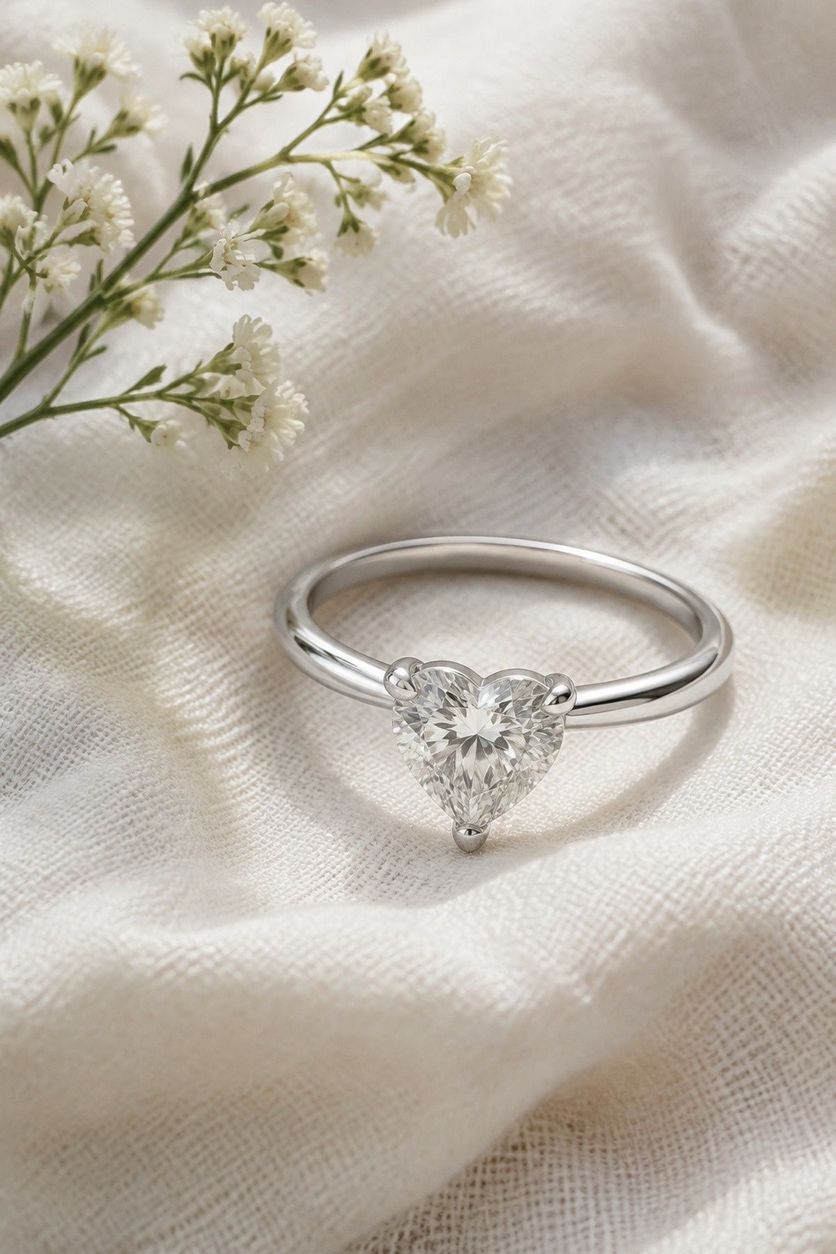 Heart-shaped solitaire on a plain band