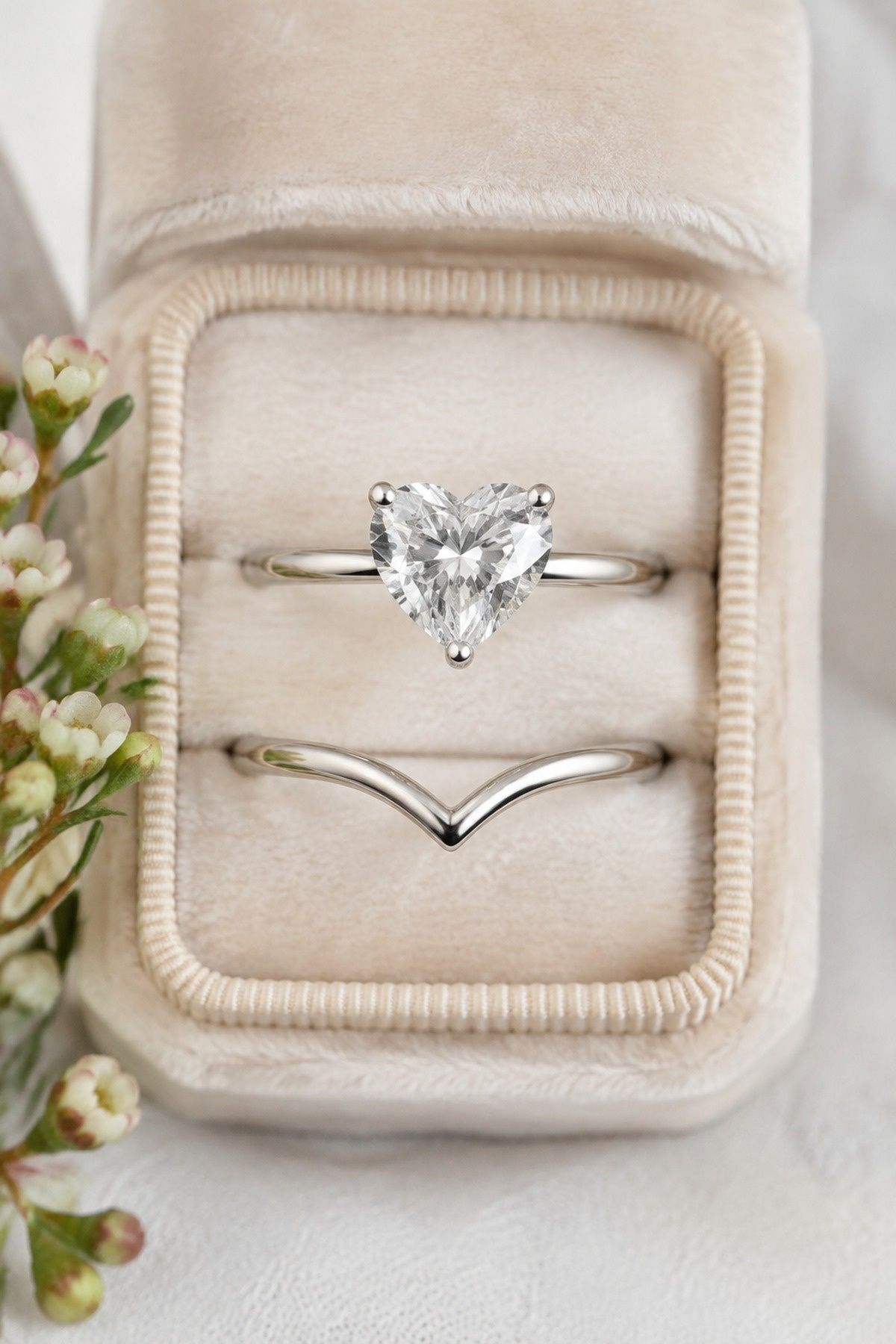 Heart ring paired with a V-shaped wedding band