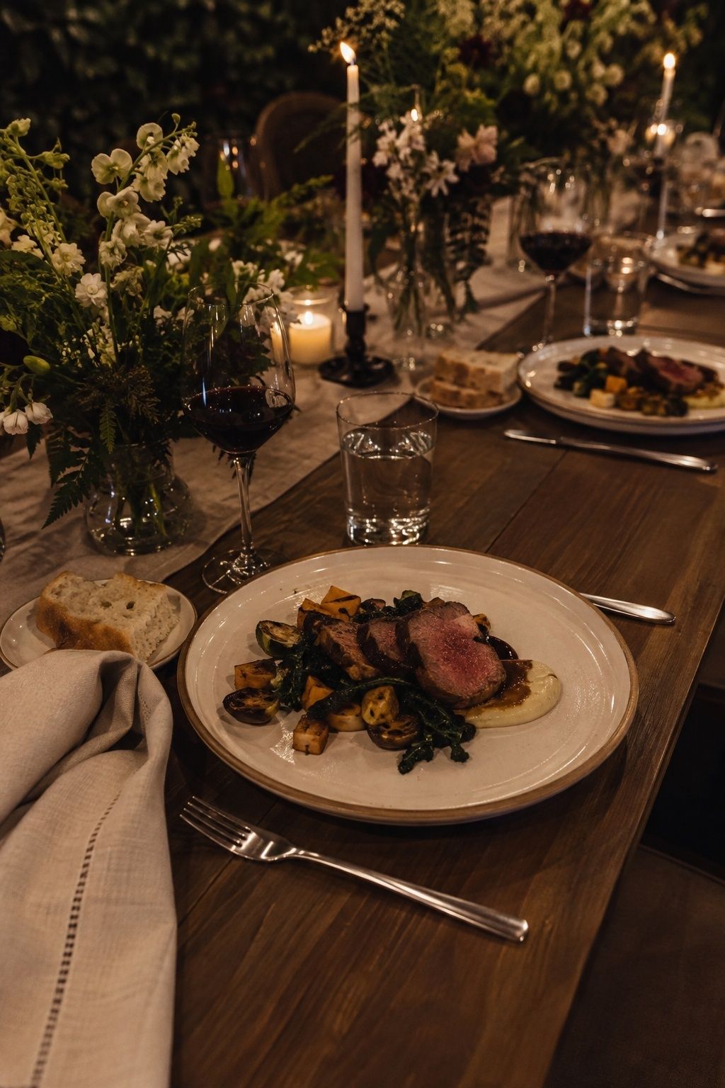 Plated dinner and wine at an intimate post-elopement reception