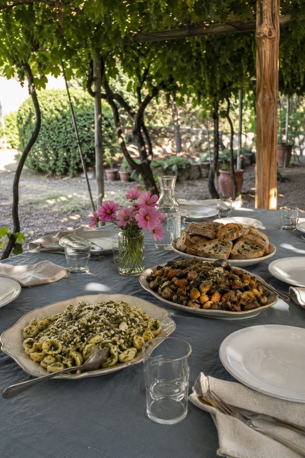 Family-style wedding meal with pasta, vegetables and bread