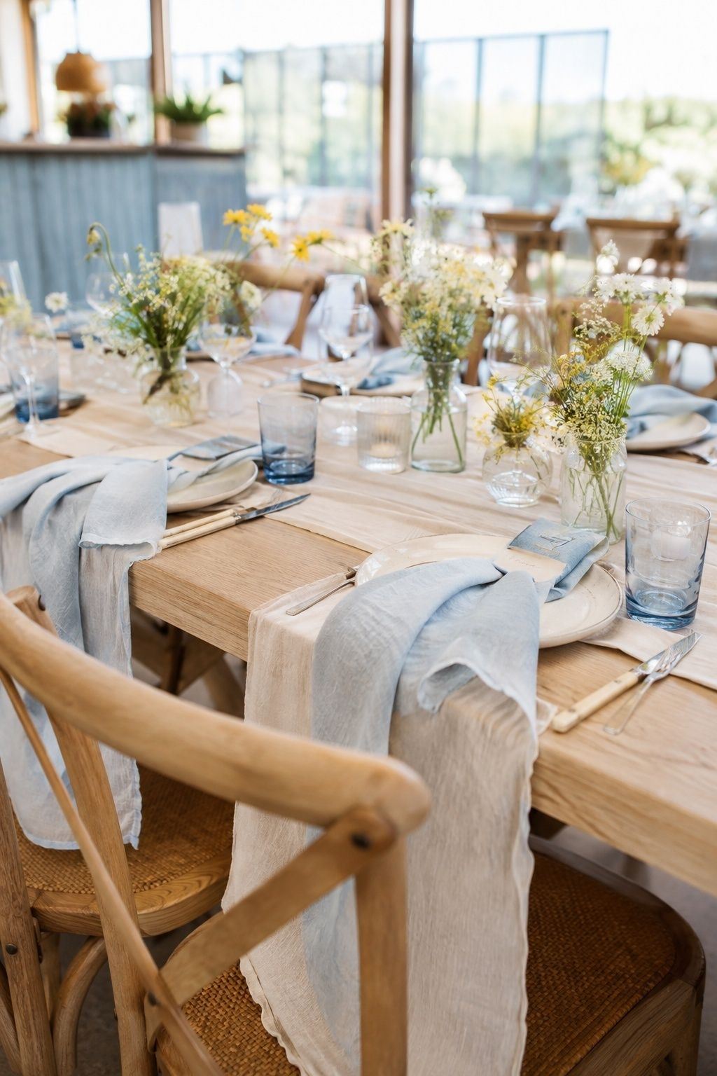 use light linens instead of heavy fabrics at an intimate indoor summer wedding reception