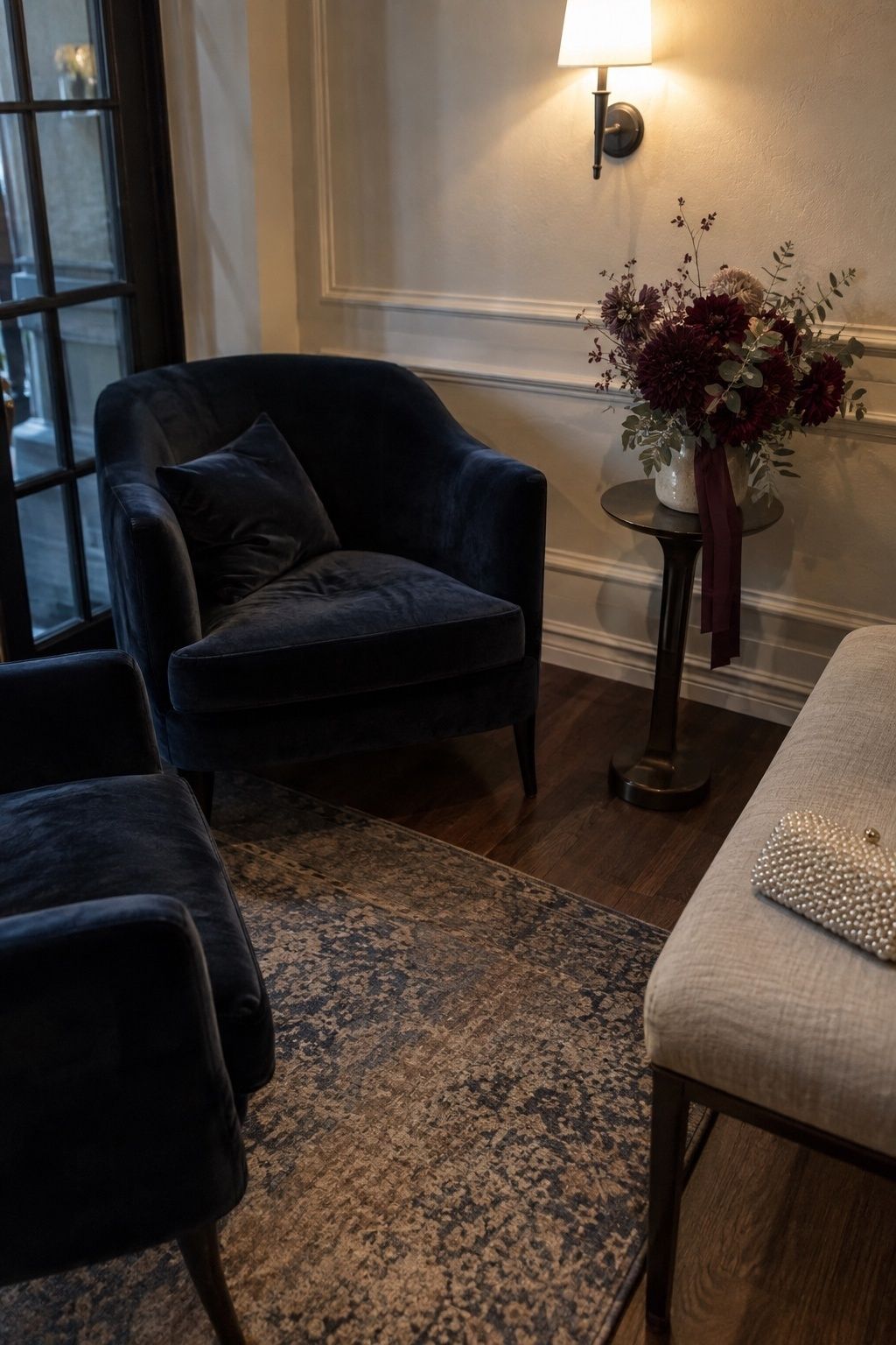 Midnight blue, plum, and pearl January wedding lounge colors